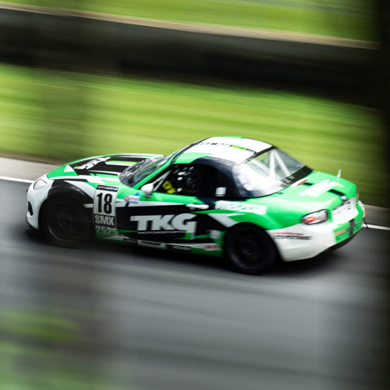 TKG Motorsports SMX Car Racing Down the Road America Back Straight.
