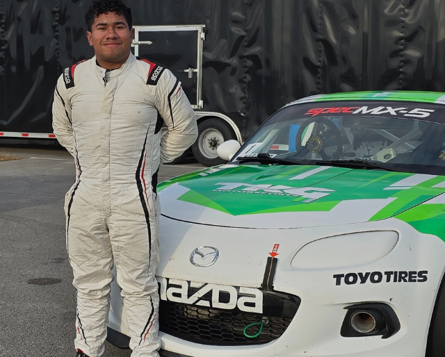 Mateo Naranjo Standing in Front of His TKG Motorsports Spec MX-5 Challenge Car.